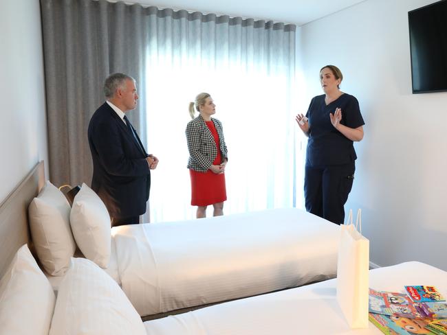 Tom's Court hotel COVID patient facility. (RtoL) Nurse Unit Manager Nikki Clark, Deputy Chief Public Health Officer, Dr Emily Kirkpatrick and Health Minister Wade, in one of the family rooms. Picture Dean Martin