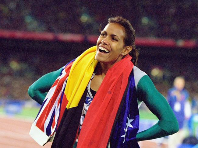 25 Sep 2000:  Cathy Freeman of Australia celebrates gold in the Womens 400m Final at the Olympic Stadium on Day Ten of the Sydney 2000 Olympic Games in Sydney, Australia. \\ Mandatory Credit: Nick Wilson /Allsport