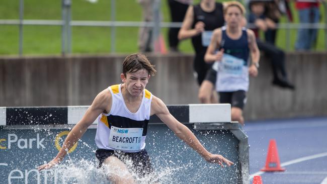 Pics by Julian Andrews. Steeplechase water jump action. Winner Isaac Beacroft from Quakers Hill.