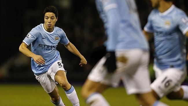 Manchester City's French midfielder Samir Nasri glides on the ball. 