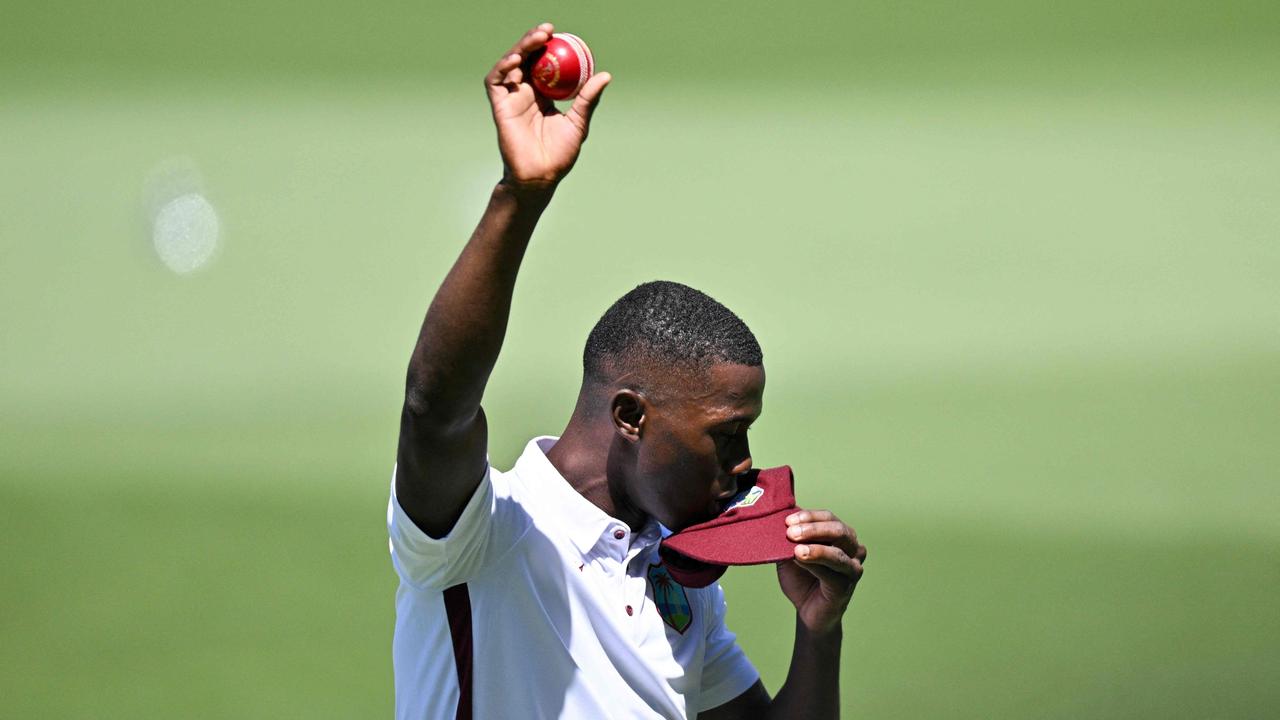 West Indies holds up the ball after taking five wickets on debut in Adelaide Picture: Izhar KHAN / AFP