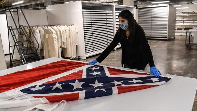 Nan Princepulls out Mississippi's retired flag at the Department of Archives and History in Jackson. Picture: AFP