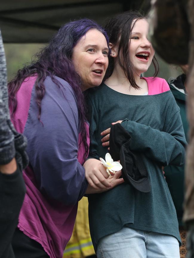 Leif’s mother Courtney hugging people just after her son was found.