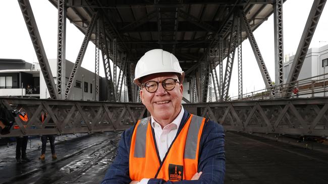 Nigel Chamier AM inspecting the Story Bridge from the suspended scaffolding. Picture: Liam Kidston