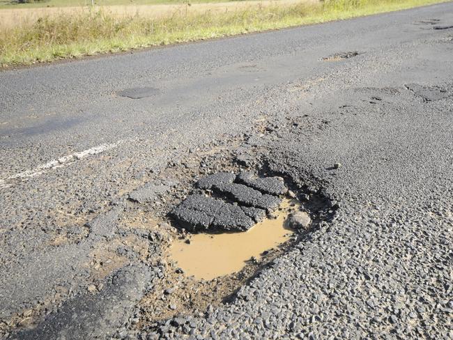 12-6-2012 Hundreds of pot holes line the Lismore to Kyogle road. Photo Doug Eaton / The Northern Star