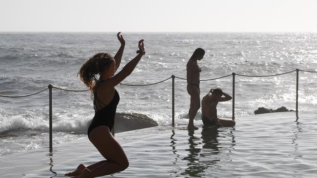 Beachgoers cool off at Bronte Beach in Sydney today.