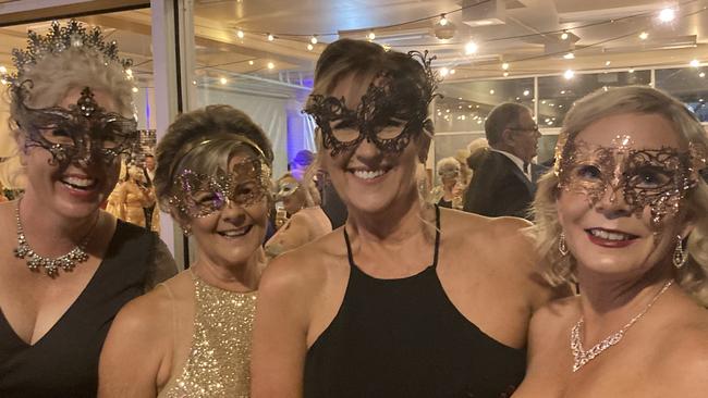 Jody Allen, Amanda Finch, Judie Finch and Kylie Dickenson celebrate at the Gympie RSL Masked Ball, April 29 2023.