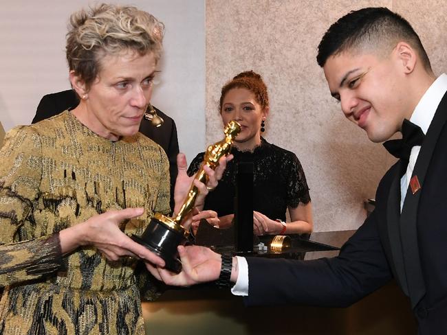 Frances McDormand, with her son Pedro, gets her Oscar engraved, shortly before it was allegedly stolen. Picture: AFP/Angela Weiss