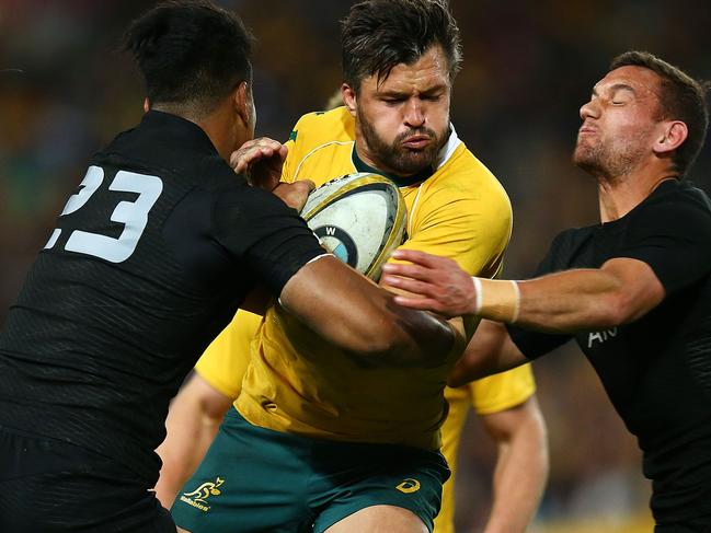 SYDNEY, AUSTRALIA - AUGUST 20: Adam Ashley-Cooper of the Wallabies is tackled during the Bledisloe Cup Rugby Championship match between the Australian Wallabies and the New Zealand All Blacks at ANZ Stadium on August 20, 2016 in Sydney, Australia. (Photo by Mark Nolan/Getty Images)