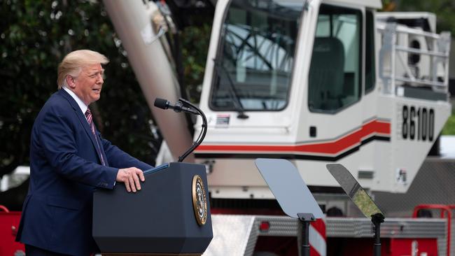 Donald Trump, at the White House on Thursday, has been told by his advisers that the economy cannot recover strongly or even at all before the November election if millions of children remain at home from school without childcare options. Picture: AFP