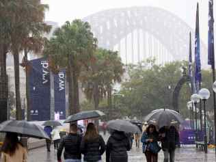 SYDNEY, AUSTRALIA - NewsWire Photos JUNE 1, 2024: People out in the rain at Circular Quay. Lots of rain forecast for Saturday and Sunday In Sydney.
Picture: NewsWire / Damian Shaw