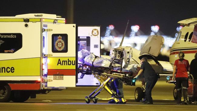 An injured person from an explosion at Grosvenor coal mine at Moranbah pictured arriving at the Royal Flying Doctors Service, Brisbane May 6, 2020. This is the second flight to arrive after an explosion at the mine left five people seriously injured. Picture: Josh Woning/AAP