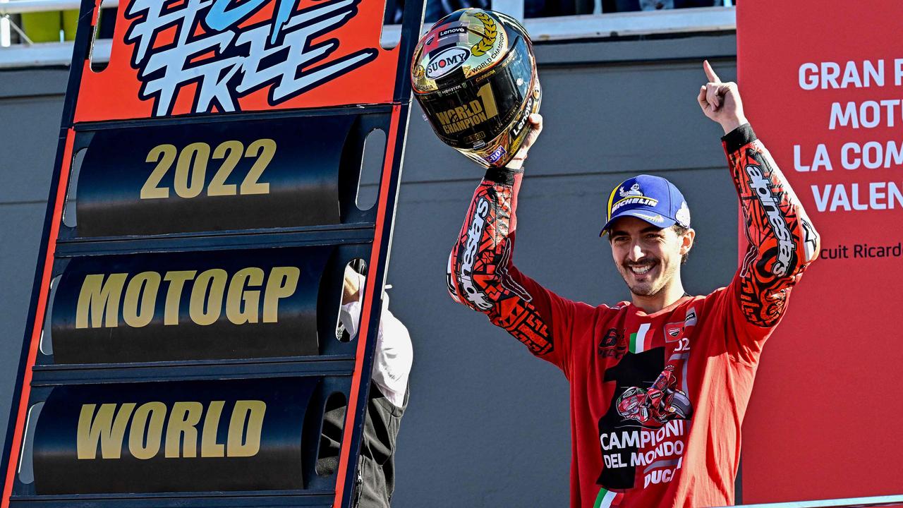 Ducati Italian rider Francesco Bagnaia celebrates as he won the World Championship's title. (Photo by JAVIER SORIANO / AFP)