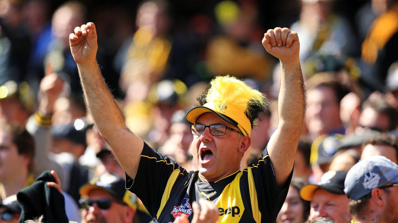 Richmond fans cheer during the 2019 AFL Grand Final match between the Richmond Tigers and the GWS Giants at the MCG on September 28, 2019 in Melbourne, Australia. Picture: Mark Stewart