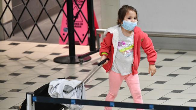 A young girl arrives in Brisbane after being evacuated from South America along with 109 other Australians on a Qantas flight from Peru. Picture: AAP