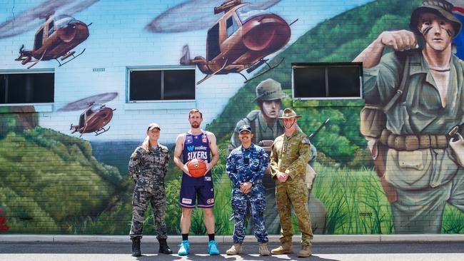 McCarron caught up with three servicemen and women ahead of the 36ers Remembrance Day game. (L-R) Kate Jennings (navy), Mitch McCarron (36ers), Fred Sabijon (air force) and Marc Bryant (Army) at the Henley Soldiers Memorial. Picture Matt Turner