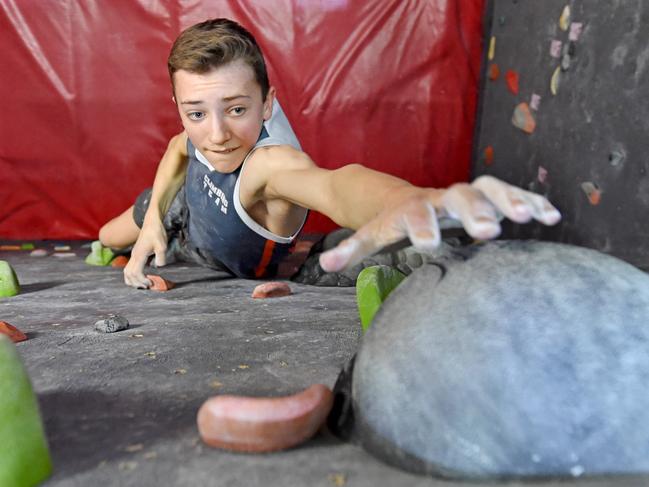 NSW State champion rock climber Hugo Hornshaw, 14, trains at The Edge Rock Climbing Centre at Castle Hill on Thursday October 4th. Hugo Hornshaw, from Box Hill, is the NSW State champion Youth B Male in lead climbing, speed climbing and bouldering. competitive rock climbing, which will be making its Olympic debut in 2020. (AAP IMAGE / Troy Snook)