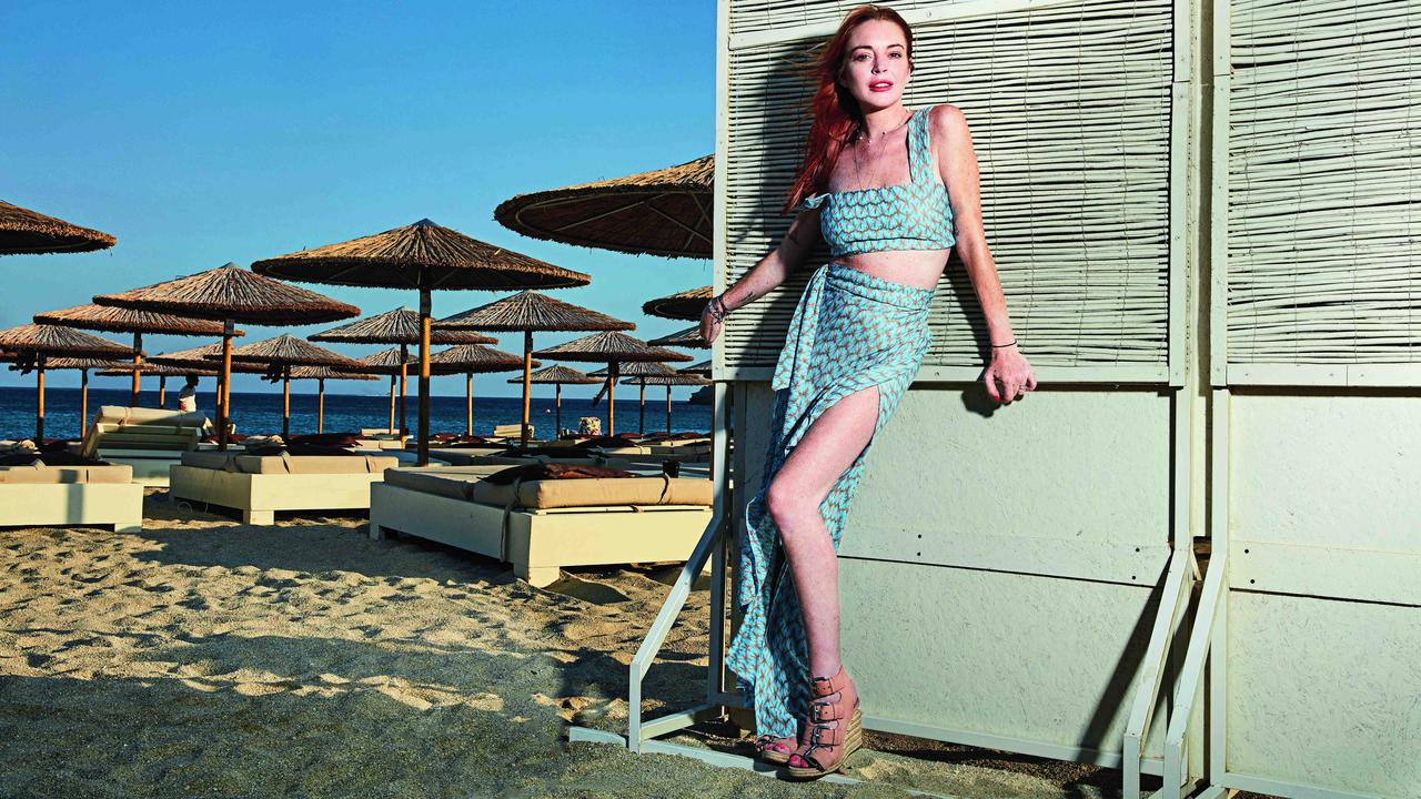 Why is Lindsay Lohan running a beach bar in Mykonos, Greece? | The  Australian