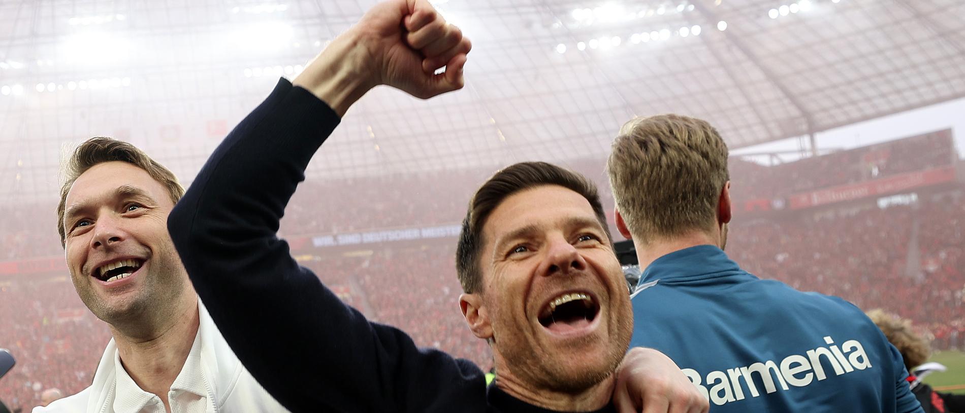 Xabi Alonso celebrates after guiding Bayer Leverkusen to its first Bundesliga title. (Photo by Lars Baron/Getty Images)