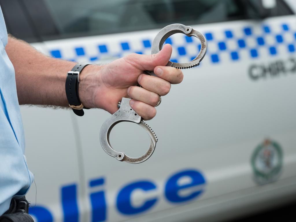 NSW police at coffs harbour boat ramp, arrest , gun, shots, handcuffsPhoto: Trevor Veale / The Coffs Coast Advocate