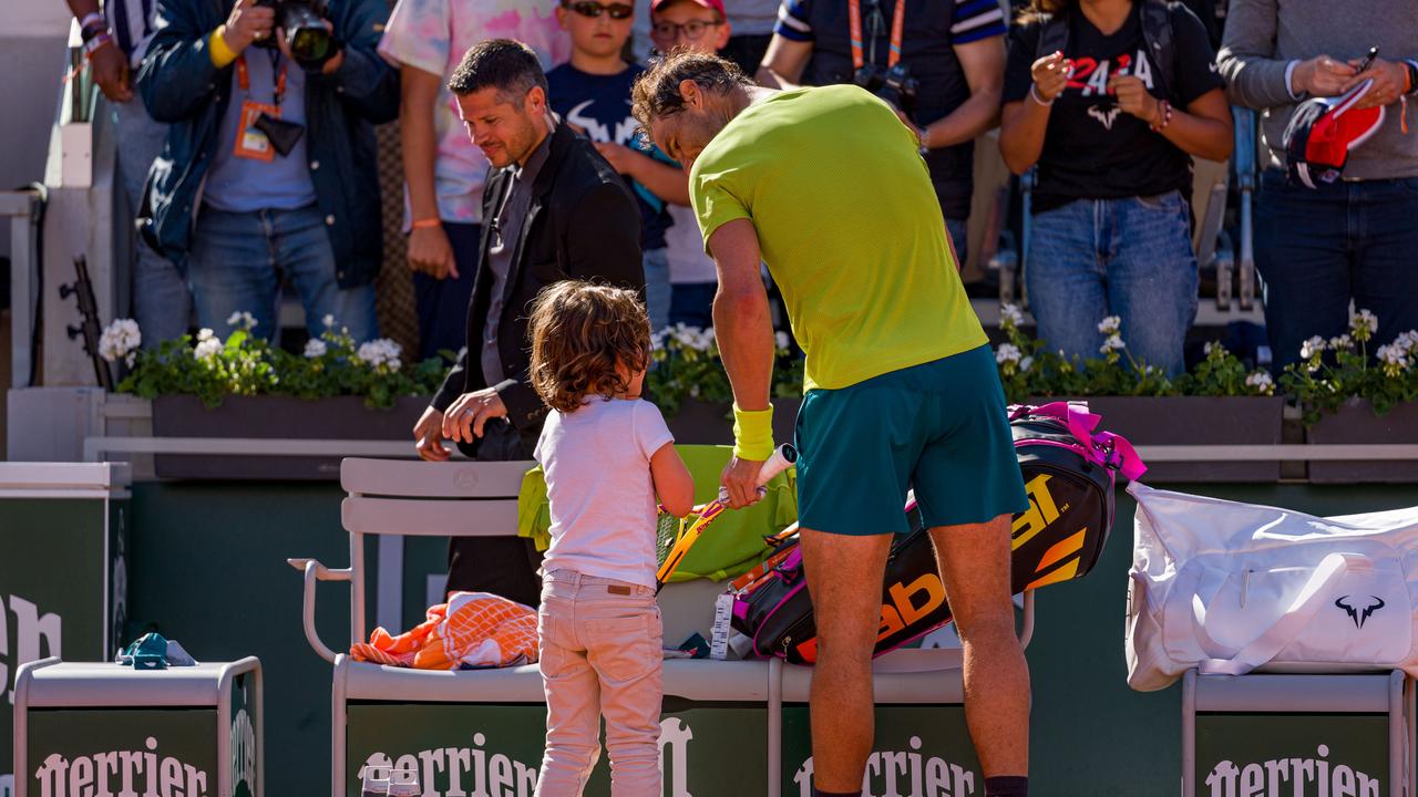 PARIS, FRANCE - MAY 27: A little boy whose name is also Rafael approached Rafael Nadal of Spain after winning match point against Botic Van De Zandschulp of Netherlands during the Men's Singles Third Round match on Day 6 of The 2022 French Open at Roland Garros on May 27, 2022 in Paris, France. (Photo by Andy Cheung/Getty Images)