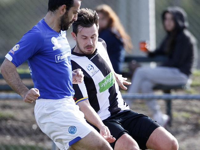 Premier League soccer - Pirates v Adelaide Blue Eagles, at Ethelton. [PIC] Pirates' James Skeffington & Blue Eagles' Christopher Atsikbasis battle for the ball.picture: Bianca De Marchi