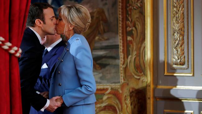 French President Emmanuel Macron kisses his wife Brigitte Trogneux during the handover ceremony in Paris, May 14, 2017. Picture: Reuters/Philippe Wojazer