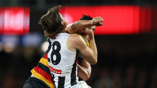 Nathan Murphy didn’t get a free kick for this collision. Picture: Sarah Reed/AFL Photos via Getty Images