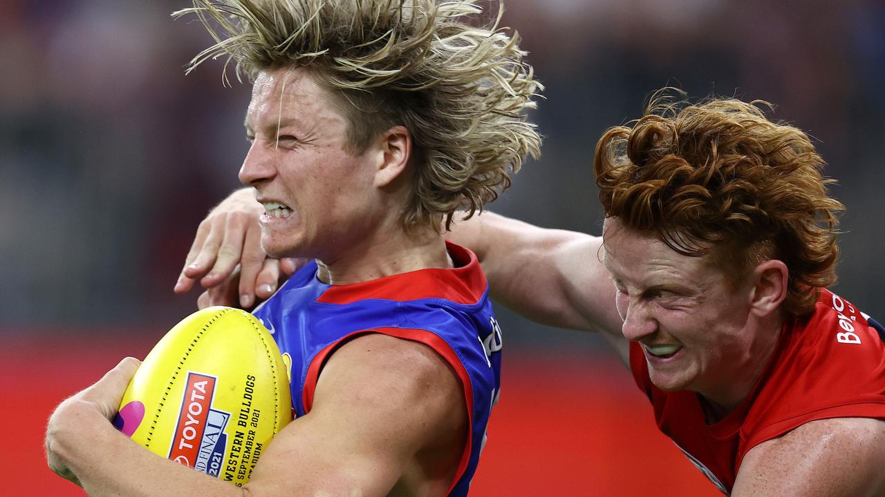 Melbourne’s Jake Bowey (right) catches Cody Weightman high in last year’s grand final. Picture: Michael Klein