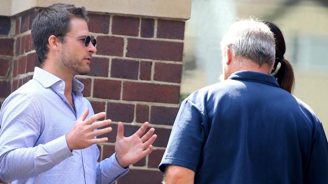 Jesse Holloway (left) with supporters outside Manly Local COurt. Picture John Grainger