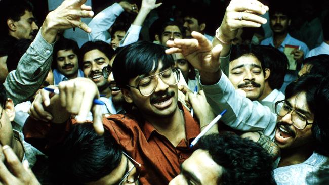 STOCK. Stock exchange. Dealers at the New Delhi stock exchange yell at each other during hectic trading. April 1992. (AP).