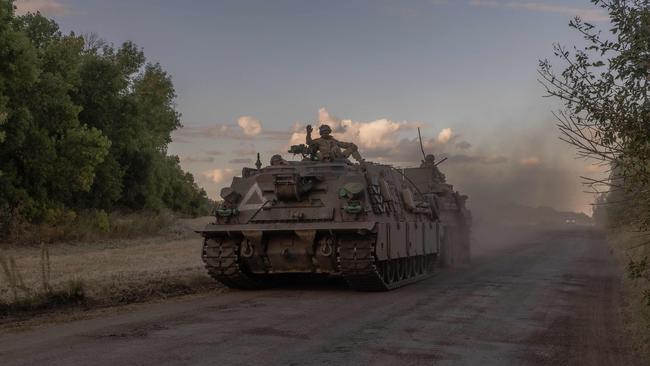 Ukrainian servicemen operate an armoured military vehicle in the Sumy region. Picture: Roman Piplipey/AFP
