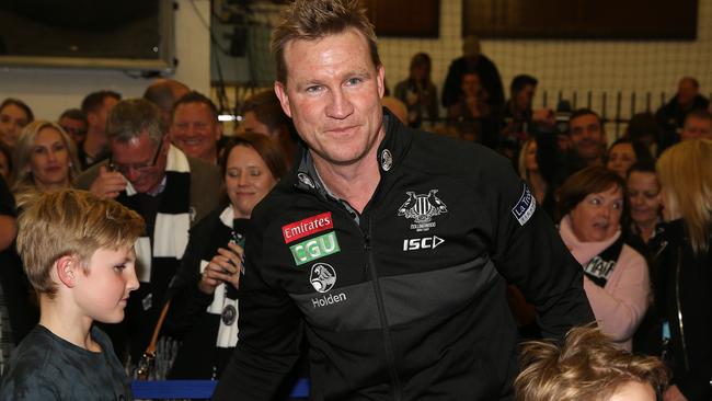 Nathan Buckley in the Collingwood rooms with his family after the game. Picture: Michael Klein