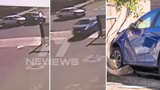 An elderly driver has slammed into a shop fence after a U-turn gone wrong. Picture: 7NEWS