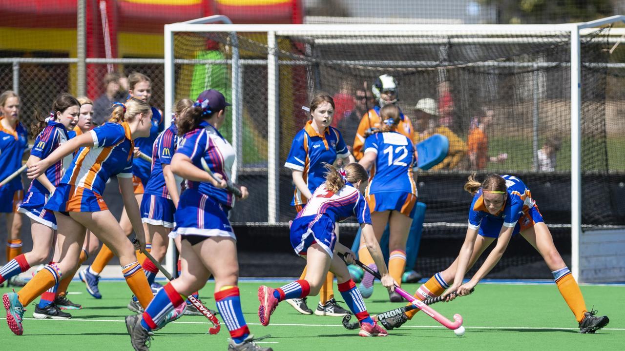 Newtown captain Briana Groves (right) defends an attack from Isla Rickert of Rangeville in J2 girls grand final hockey at Clyde Park, Saturday, September 10, 2022. Picture: Kevin Farmer