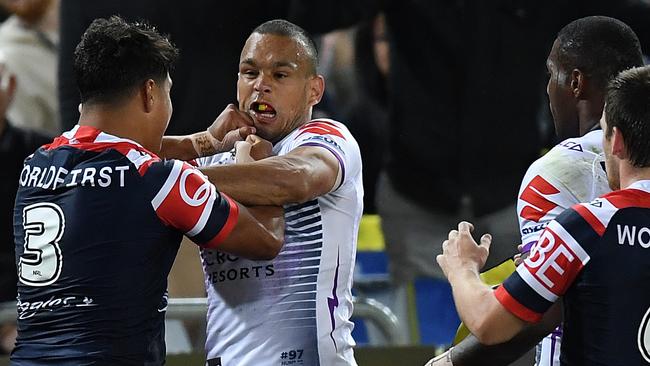 Latrell Mitchell and Will Chambers come to blows during the grand final. (AAP Image/Joel Carrett) NO ARCHIVING, EDITORIAL USE ONLY