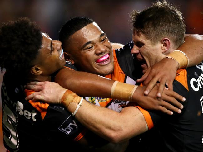 Tigers Moses Suli celebrates scoring his try with team matesduring NRL  game between the Wests Tigers and the Newcastle Knights at Leichhardt Oval . Picture : Gregg Porteous