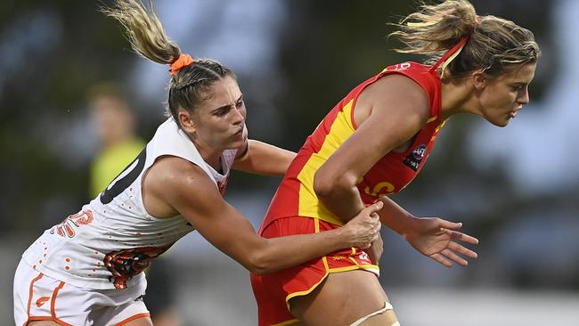 Lauren Bella of the Suns is tackled by Lisa Steane of the Giants during the round one AFLW match between the Gold Coast Suns and the Greater Western Sydney Giants at the Great Barrier Reef Arena on January 09, 2022 in Mackay, Australia. (Photo by Ian Hitchcock/Getty Images)