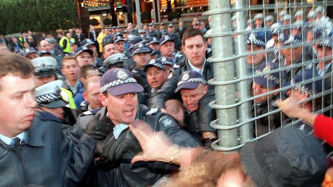 Police seek to control S11 protesters at Crown Casino in 2000.