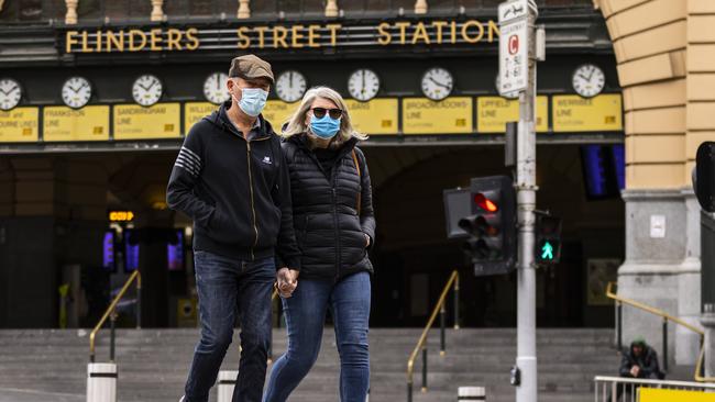 Victorians are free to wear mask where they want, but mandates still apply to transport and high-risk areas. Picture: Daniel Pockett