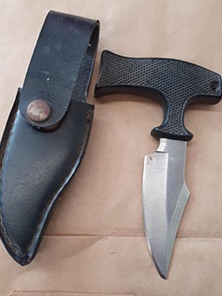 A sheath knife and a push dagger were found by police …