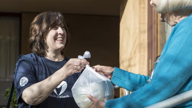 Volunteers play an important community role in delivering to homes for Meals on Wheels