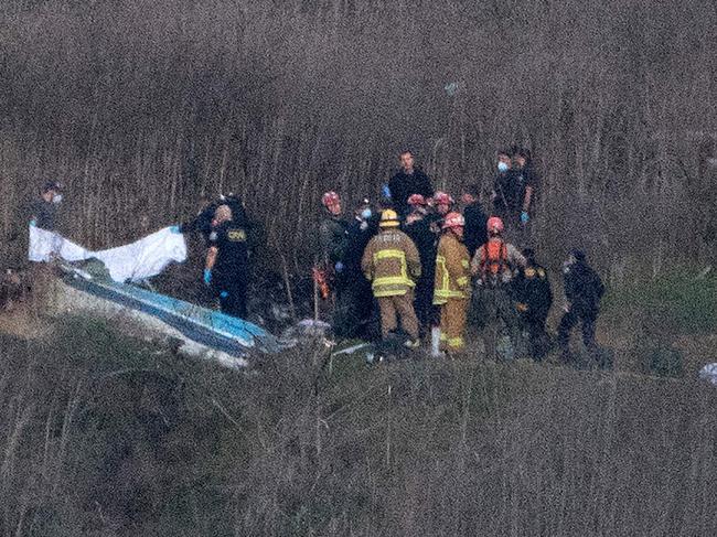 First responders at the crash site. Picture: AFP