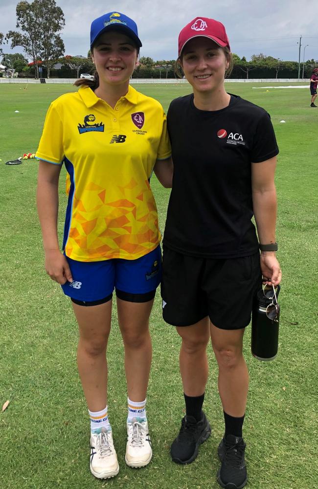 Gladstone cricketer Mahli Rea pictured with Queensland Fire player Haidee Birkett.