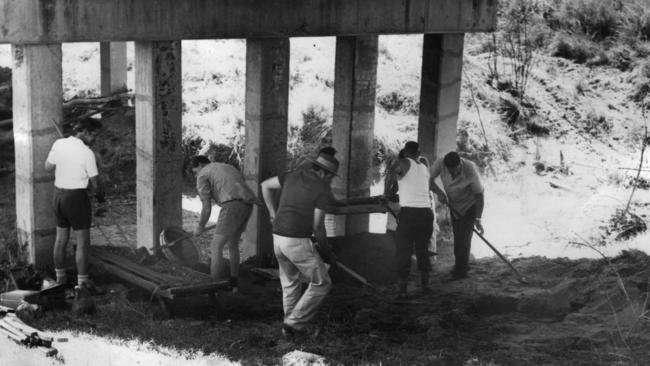 November 18, 1972:. Police digging and sifting soil under the Sensible Creek railway bridge west of Charters Towers where a skeleton was found. Photo: COURIER MAIL
