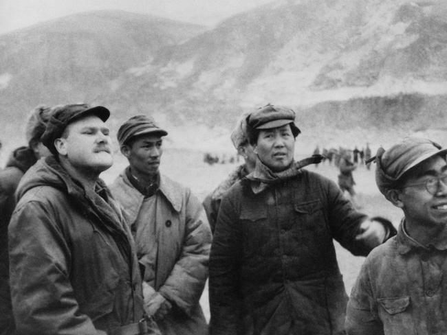 Mao Zedong (second from right) with American journalist John Roderick (left) in January 1046 when the struggle between communists and KMT was still ongoing. Picture: AP