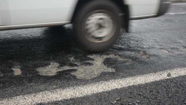 A pothole near Gordonvale, as a number of hazards begin appearing on Far Northern roads following three days of heavy rain.