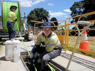 Workers linstall NBN cable. Picture: Chris Higgins