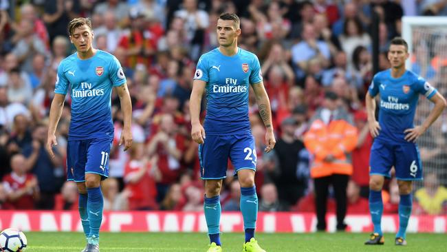 Mesut Ozil and Granit Xhaka looked dazed after another Anfield rout. (Michael Regan/Getty Images)