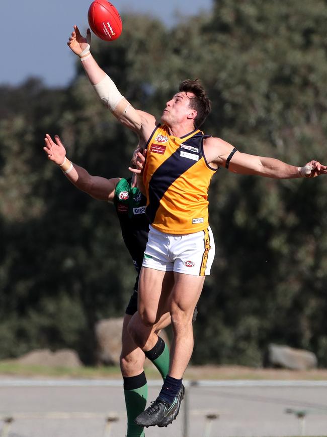 Strathmore’s Ben Bese attempts a mark. Picture: Mark Dadswell